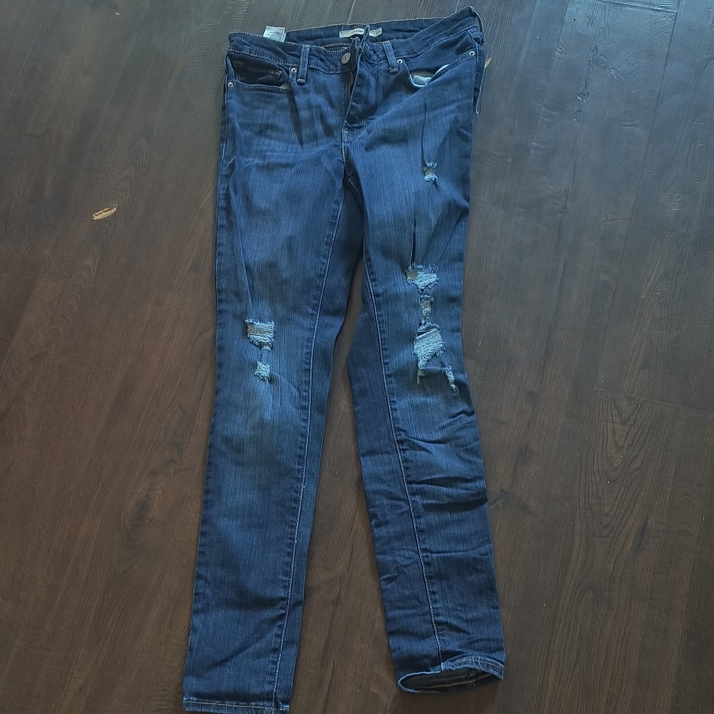 Distressed Levi's Blue Jeans